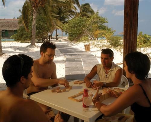 'Cayo Levisa - jugando domino' Check our website Cuba Travel Hotels .com often for updates.